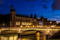 Night view of Conciergerie Castle and Bridge of Change over rive Royalty Free Stock Photo