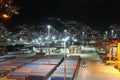 Night view on container terminal in the Port of La Guaira observed from cargo ship moored below gantry cranes. Royalty Free Stock Photo