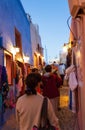 Night view of crowded narrow commercial street Oia Santorini Greece Royalty Free Stock Photo
