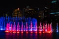 Night view of the dancing multi-colored fountains. Show of Singing Fountains