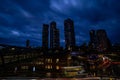 Night view of Deansgate Square with its four skyscraper towers under the cloudy sky Royalty Free Stock Photo