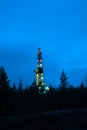 A night view of a derrick drilling.