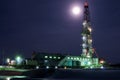 A night view of a derrick drilling in Siberia