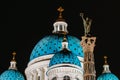 Night view domes with stars of the Troitsky Cathedral in Saint-Petersburg