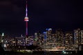 Night view on Downtown Toronto skyscrapers with brightly lit windows with the colorfully lit CN Tower, Toronto, Ontario Royalty Free Stock Photo