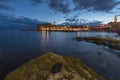 Night view of Dubrovnik old town from seaside with reefs in foreground, Croatia Royalty Free Stock Photo