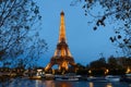 The night view of the Eiffel Tower, famous monument glowing at dusk located at bord of Seine river. Paris.France.