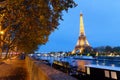 The night view of the Eiffel Tower, famous monument glowing at dusk located at bord of Seine river. Paris.France.