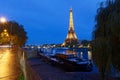 The night view of the Eiffel Tower, famous monument glowing at dusk located at bord of Seine river. Paris.France.