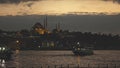 Night view of Eminonu Harbor, Beyoglu district historic architecture and Muslim Mosque in Istanbul Turkey on a twilight