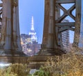 Night view of the Empire State Building through the pylons of Manhattan Bridge. View from Washington Street in Dumbo Royalty Free Stock Photo