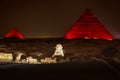 Night view on the enlighted Pyramids of Giza, Egypt Royalty Free Stock Photo