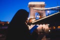 Night view of a famous Budapest Szechenyi Chain Bridge, a suspension bridge that spans the River Danube between Buda and Pest, the Royalty Free Stock Photo