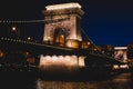 Night view of a famous Budapest Szechenyi Chain Bridge, a suspension bridge that spans the River Danube between Buda and Pest, the Royalty Free Stock Photo