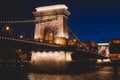 Night view of a famous Budapest Szechenyi Chain Bridge, a suspension bridge that spans the River Danube between Buda and Pest, the Royalty Free Stock Photo