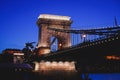 Night view of a famous Budapest Szechenyi Chain Bridge, a suspension bridge that spans the River Danube between Buda and Pest, the Royalty Free Stock Photo