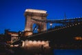 Night view of a famous Budapest Szechenyi Chain Bridge, a suspension bridge that spans the River Danube between Buda and Pest, the Royalty Free Stock Photo