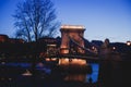 Night view of a famous Budapest Szechenyi Chain Bridge, a suspension bridge that spans the River Danube between Buda and Pest, the Royalty Free Stock Photo