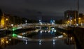 Night view of the famous illuminated Ha Penny Bridge in Dublin, Ireland Royalty Free Stock Photo