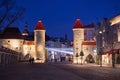 TALLINN, ESTONIA - JANUARY 12, 2018: Night view of the famous medieval Viru Gate with Christmas decorations in historical part of