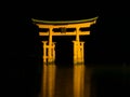 A night view of the floating torii gate at UNESCO World Heritage Itsukushima Shrine on the island of Miyajima in Japan Royalty Free Stock Photo