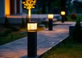 Night View Of Flowerbed Illuminated By Energy-Saving Solar Powered Lantern On Courtyard. Beautiful Small Garden Light Royalty Free Stock Photo