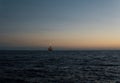 FPSO tanker vessel near Oil Rig at night. Offshore oil and gas industry Royalty Free Stock Photo