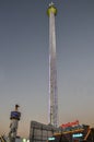 Night view of the Free fall tower at Oktoberfest. People can get a thrill from a free fall from this tower Royalty Free Stock Photo