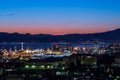 Night view of Genoa city center, buildings, skyscrapers and sea in Genoa, Italy Royalty Free Stock Photo