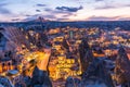 Night view of Goreme town with cave hotel built in rock formation in national park Goreme, Cappadocia, Turkey