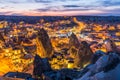 Night view of Goreme town with cave hotel built in rock formation in national park Goreme, Cappadocia, Turkey Royalty Free Stock Photo