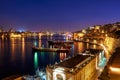 The night view of Grand Harbour with the cargo ships moored near Royalty Free Stock Photo