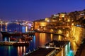 The night view of Grand Harbour with the cargo ships moored near Royalty Free Stock Photo