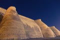 Night view of historical Ark fortess in Bukhara city, Uzbekistan. Wall of the Bukhara Fortress, the Ark. Royalty Free Stock Photo