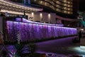 Night view of hotel Palm apartments waterfall illuminated by colorful lights in Batumi city - the capital of Adjara in Georgia Royalty Free Stock Photo