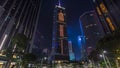 Night view hyperlapse of modern city in park with fountain and skyscrapers around. Time lapse. Hong Kong Royalty Free Stock Photo