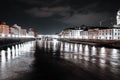 Night view of illuminated Buildings by the reflecting river in Florence City in Italy Royalty Free Stock Photo