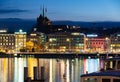 Night view of illuminated Geneva cityscape seen from lake