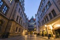 Night view of illuminated narrow street with old historic buildings of Dresden city, Germany. Royalty Free Stock Photo