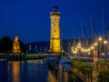 Night view of illuminated New Lindauer Lighthouse at harbor of Lindau at lake Bodensee in Germany Royalty Free Stock Photo