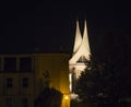 Night view of illuminated Towers of modern roof with steeples of gothic Emmaus Monastery Emauzy in Prague center