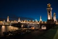 Night view on iluminated bridge in Paris France Royalty Free Stock Photo