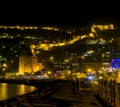 Night view image of old city near sea with ancient castle, houses and stone walls scenery between lights from Alanya Antalya Turke Royalty Free Stock Photo