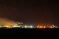 Night view of industrial district of the city and smoke pipes of factory Royalty Free Stock Photo