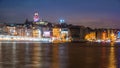 Night view of Istanbul cityscape Galata Tower with floating tourist boats in Bosphorus ,Istanbul Turkey