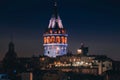 Night view of Istanbul cityscape Galata Tower with floating tourist boats in Bosphorus ,Istanbul Turkey