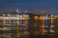 Night view of Istanbul cityscape Galata Tower with floating tourist boats in Bosphorus ,Istanbul Turkey