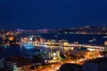 Night view of Istanbul, scenic cityscape with buildings in lights, bridge, bay and blue sky with full moon, Turkey Royalty Free Stock Photo