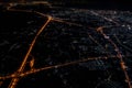 Night view from the jetplane in twilight time with the red sky and light of the city