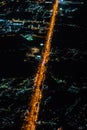 Night view from the jetplane in twilight time with the red sky and light of the city